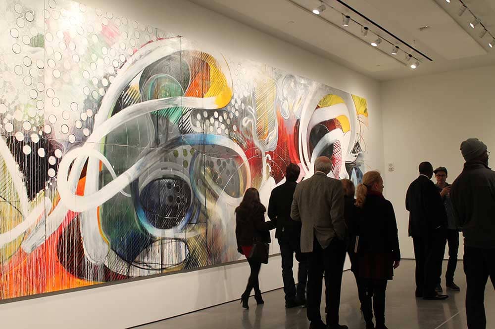 People viewing art in art gallery