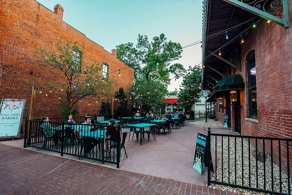 A series of tables sit outside a restaurant in Old Colorado City.
