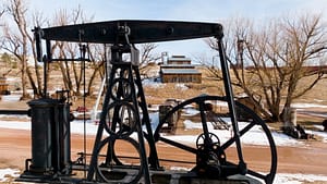 Outdoor machinery at the Western Museum of Mining & Industry during winter