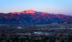A pink sunrise on Pikes Peak, called Sun Mountain by the Ute of Colorado.
