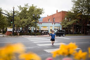 Woman crossing the street in Old Colorado City