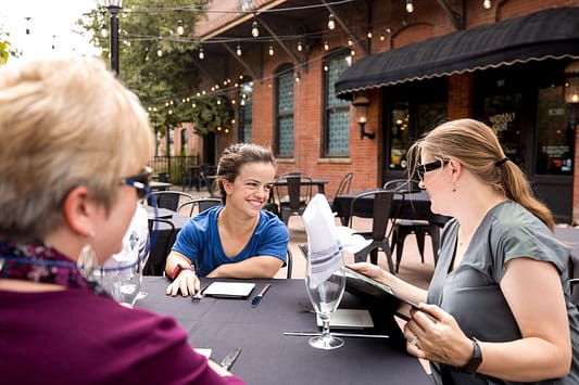 People dining outdoors in Old Colorado City.