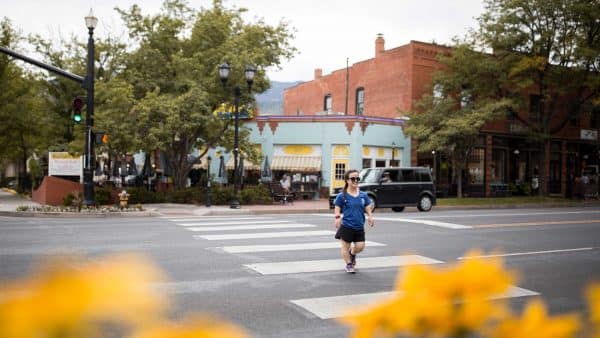 Woman crossing the street in Old Colorado City