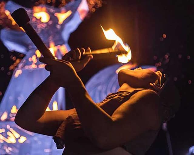 Person dancing with fire at the Manitou Springs Carniball
