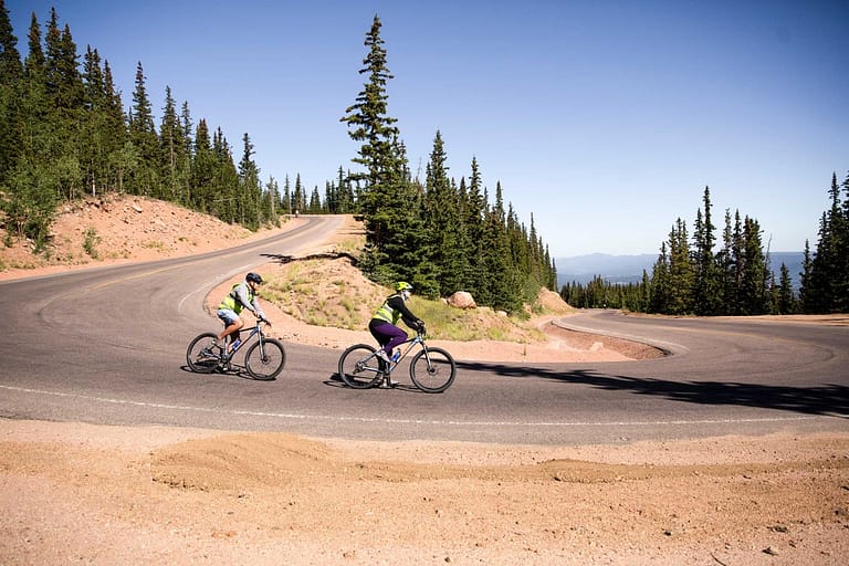 People biking down Pikes Peak