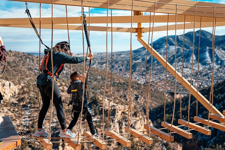 Mother and Son on the windwalker high ropes course at the Cave of the Winds