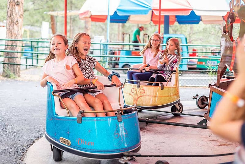 Little kids on ride at North Pole - Santa's Workshop