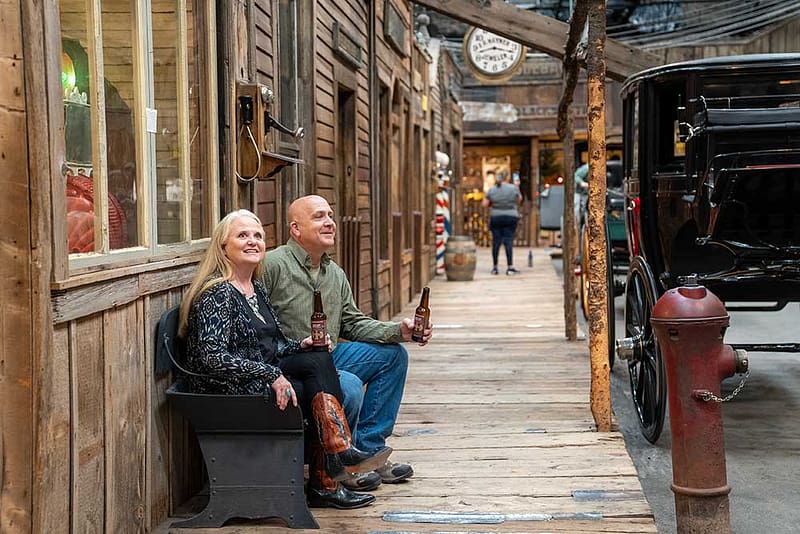 A couple sits at Ghost Town Museum.