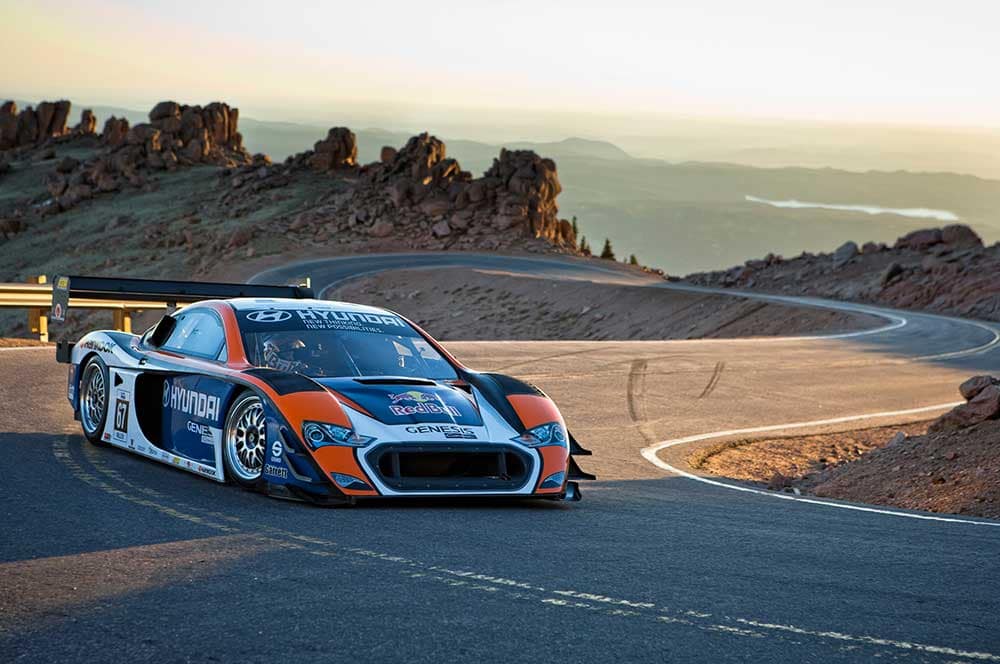 Race car driving up Pikes Peak for the Pikes Peak International Hill Climb.