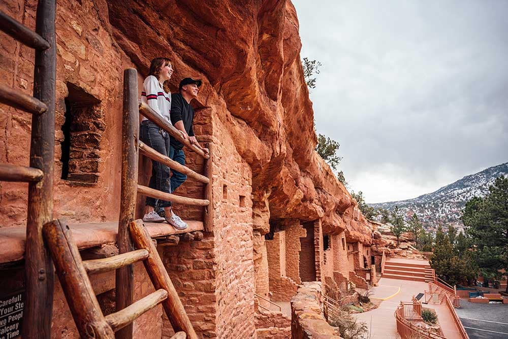 Couple enjoying views from a balcony in the Manitou Cliff Dwellings