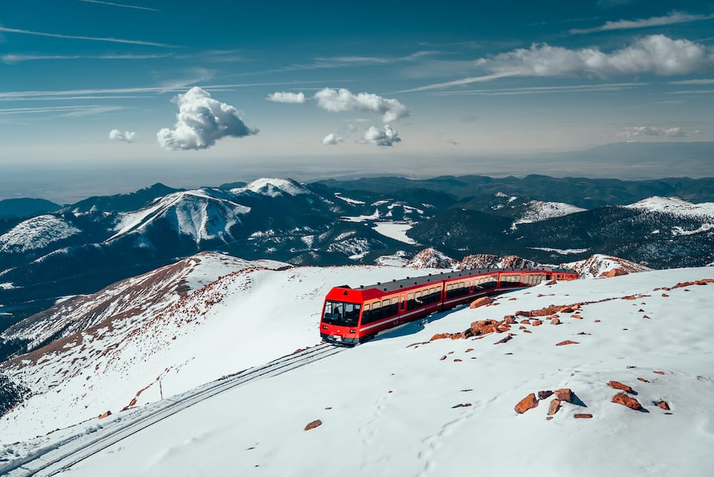 The Cog Railway ascends to the Pikes Peak summit — the top train in Colorado at 14,115 feet.