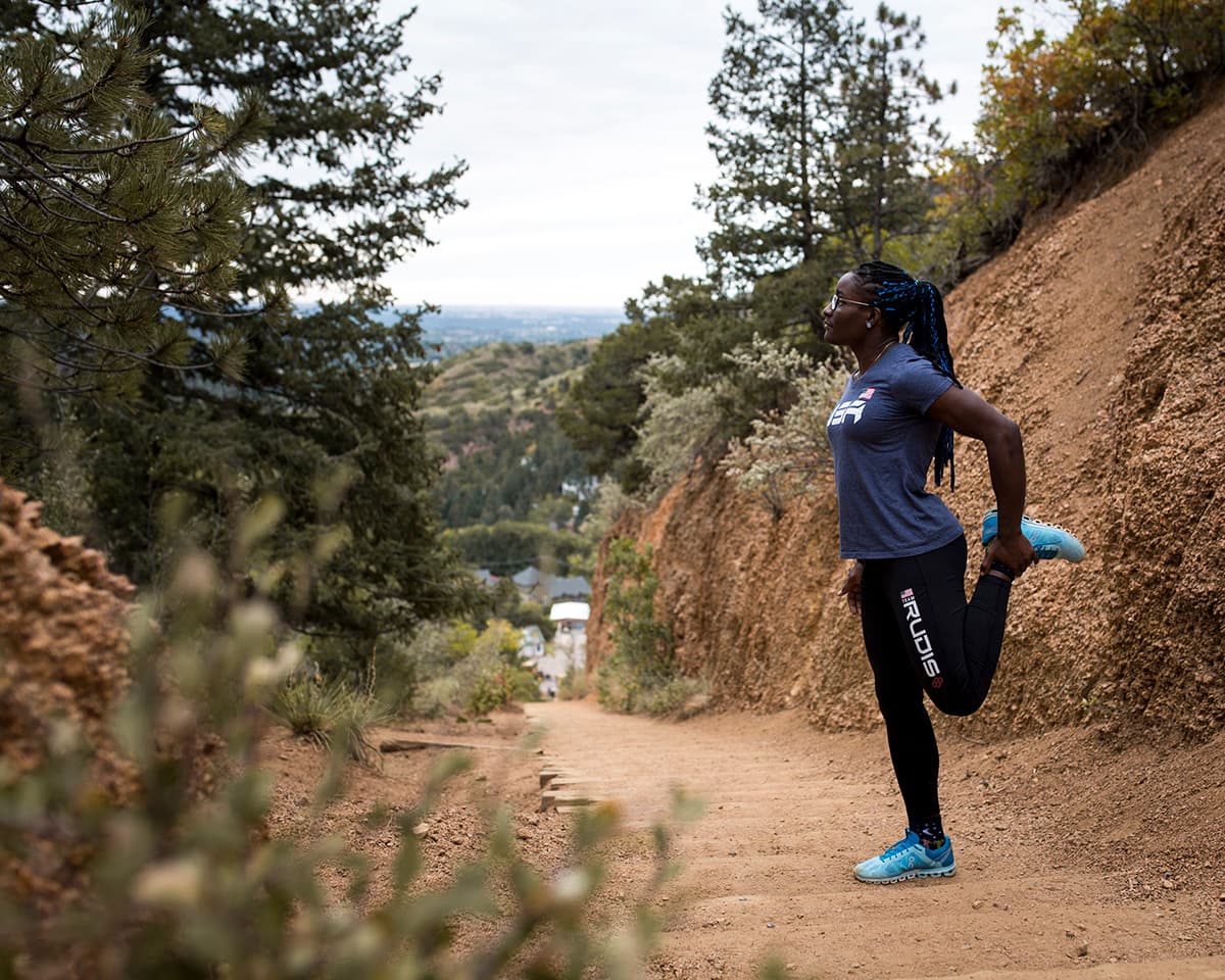 Woman stretching on the incline trail.