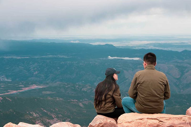 Couple enjoying views from top of Pikes Peak