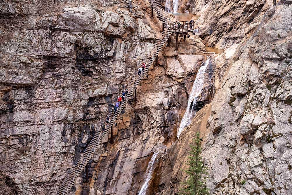 The stairs of Seven Falls from a distance.