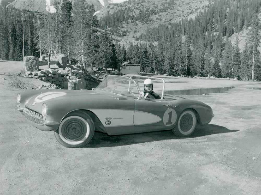 A classic race car parks along a pull-off following the Pikes Peak International Hill Climb.
