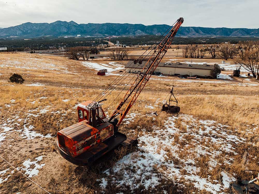 A drone point of view of the Western Museum of Mining & Industry and mining equipment.