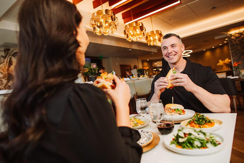 A man and a woman dining in a restaurant