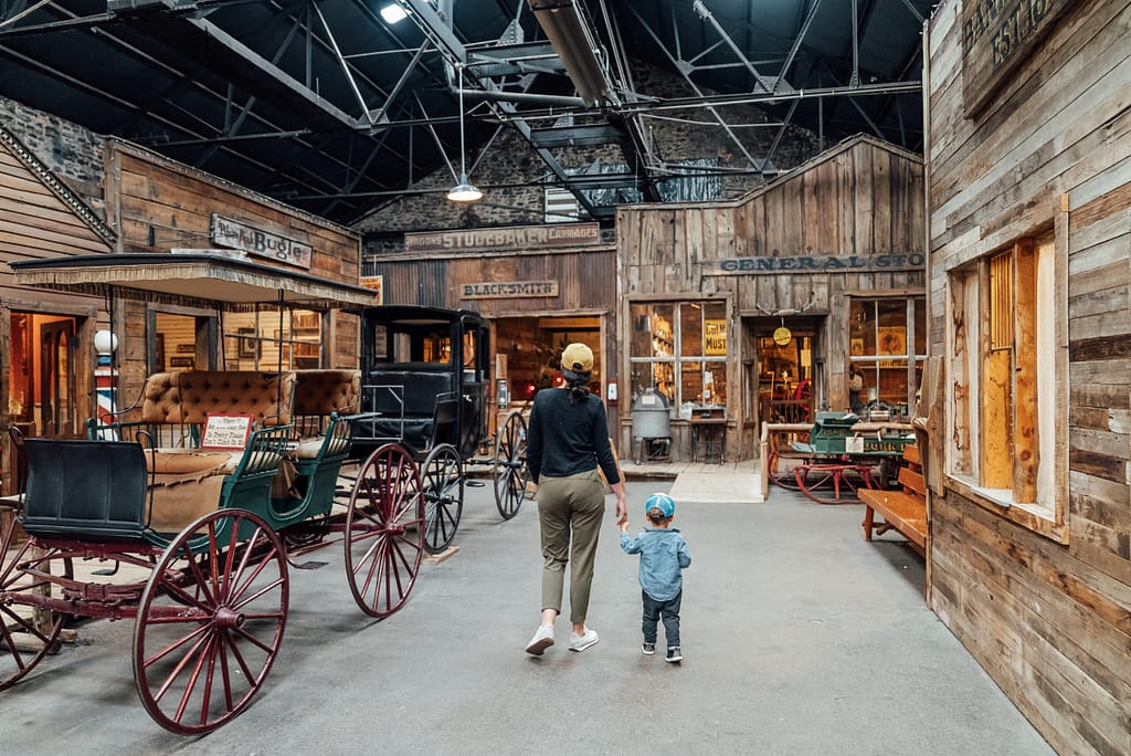 Mother and son walking through Ghost Town Museum