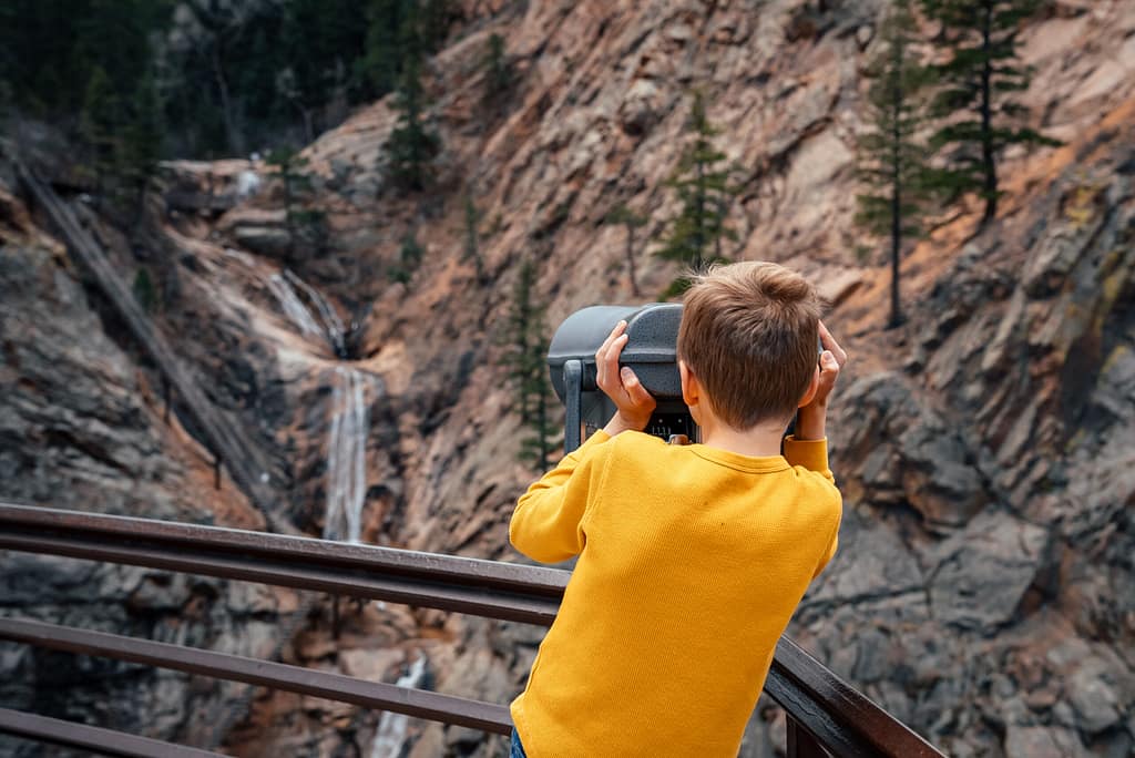 Boy overlooking Seven Falls