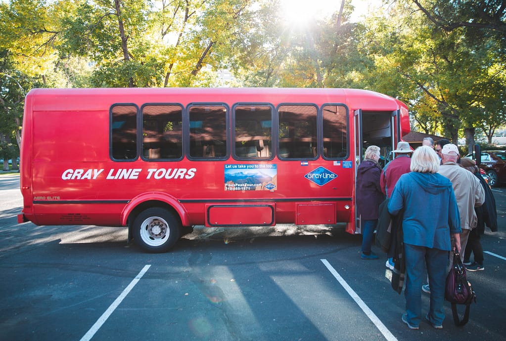 People boarding a Gray Line bus