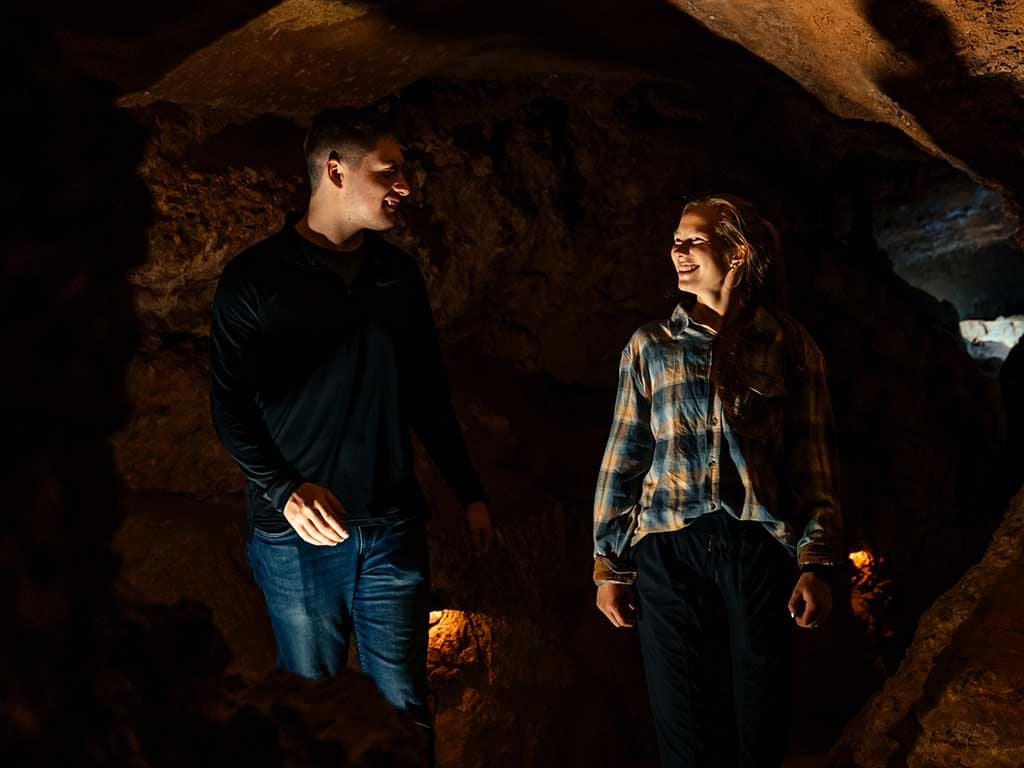 Couple walking in Cave of the Winds