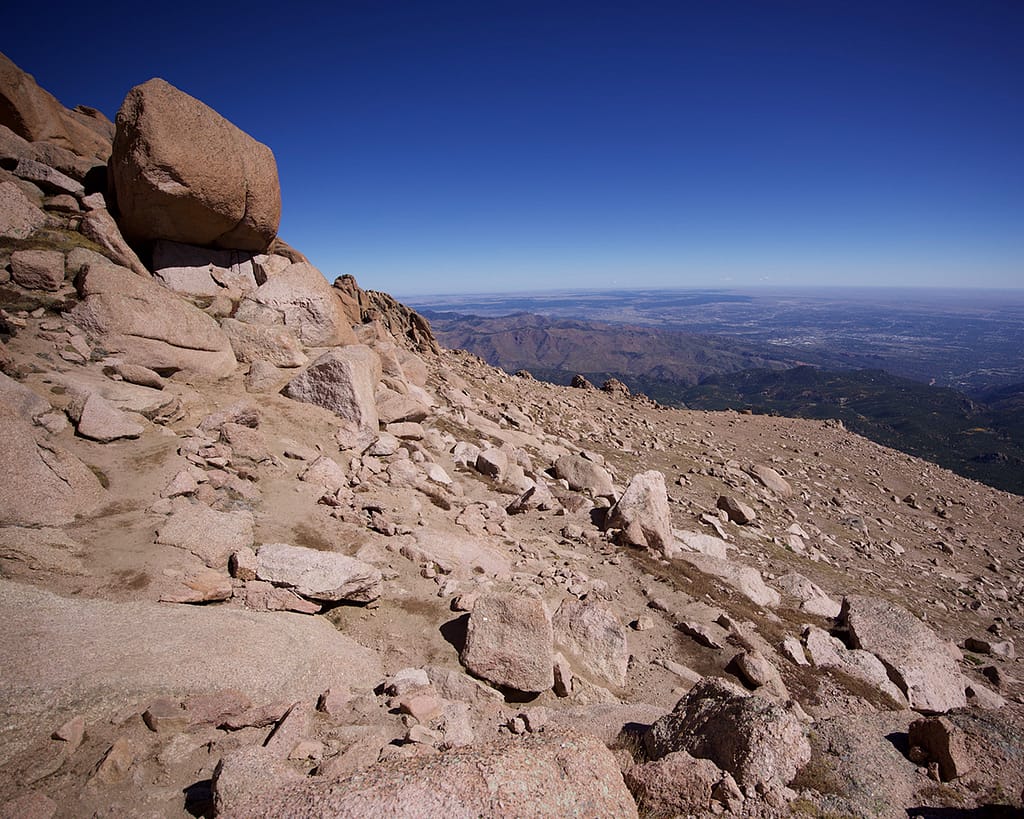 Rocks on the summit of Pikes Peak overlooking the plains.