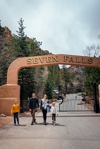 Family walking through front gate at Seven Falls