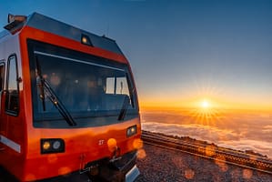 Pikes Peak Cog Railway at the top of Pikes Peak during sunrise