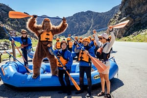 Bigfoot posing with group on Echo Canyon River Expeditions raft