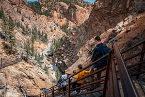 Family walking down stairs at Seven Falls