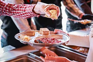 A Flying W Ranch Chuckwagon meal steams at the table.