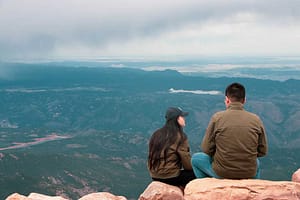 Couple enjoying views from top of Pikes Peak