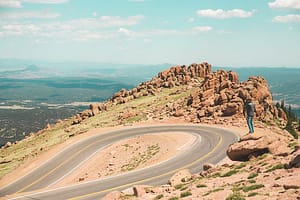 A photographer taking a picture near the Pikes Peak Highway.