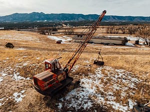 A drone point of view of the Western Museum of Mining & Industry and mining equipment.