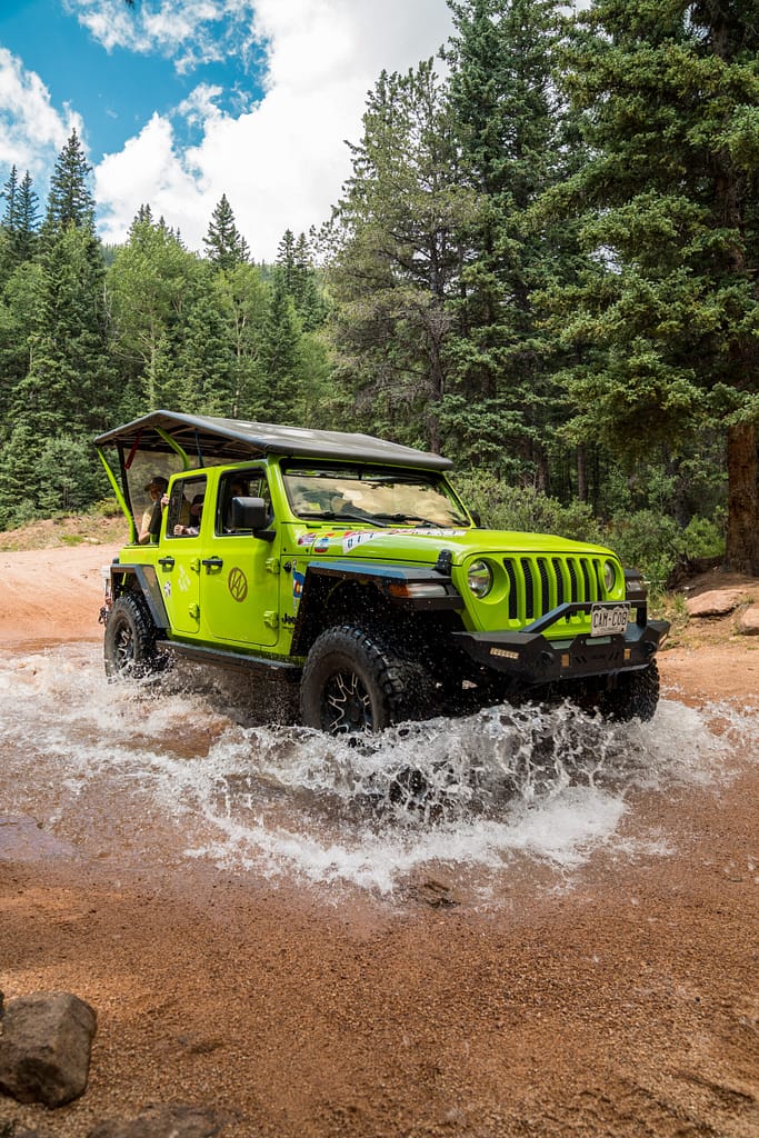 Adventures Out West Jeep driving through stream