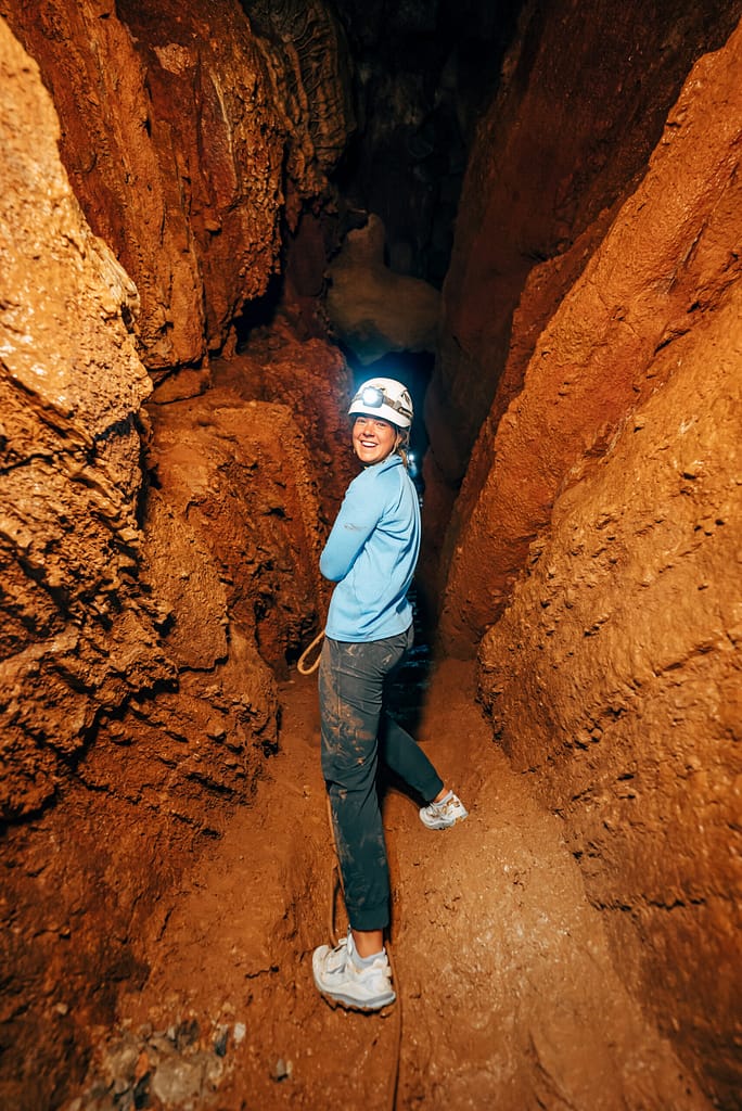Woman walking through Cave of the Winds