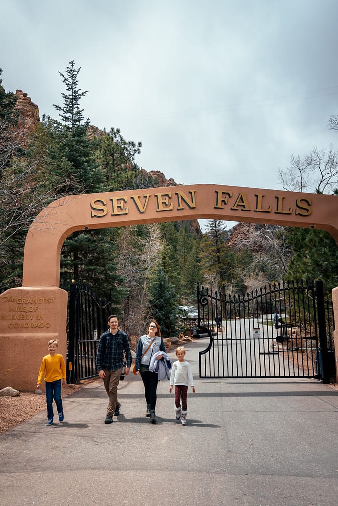 Family walking through front gate at Seven Falls